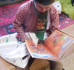 Northern Afghanistan child reading book