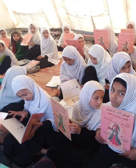 classroom of girls with Hoopoe books